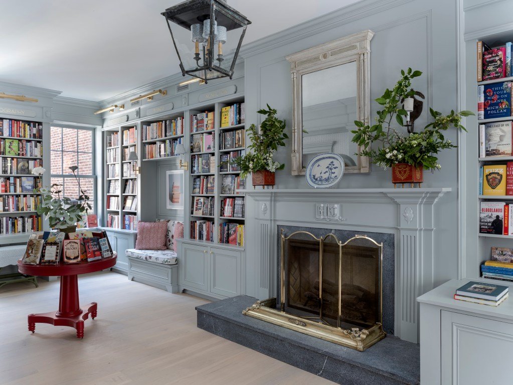 interior of Beacon Hill Books and Cafe with fireplace and book-lined shelves
