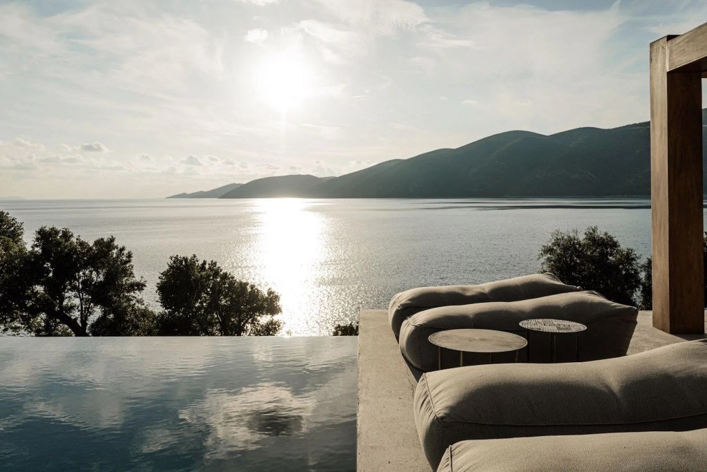 sitting area in Greek Isles home exterior overlooking the water and horizon